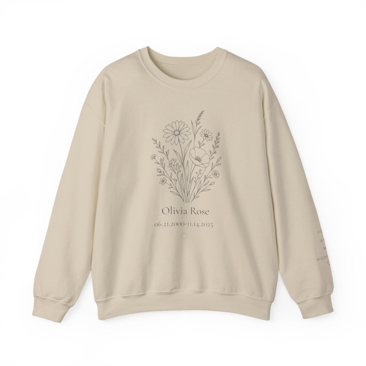 Neutral personalized memorial sweatshirt with a wildflower bouquet, the name Olivia Rose, remembrance dates, and a small heart